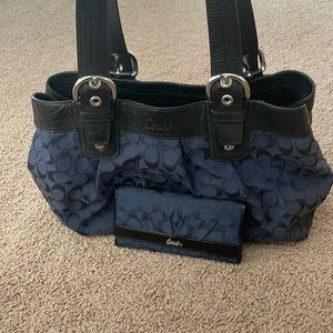 Gently used matching Coach bag and wallet in Navy Blue.
